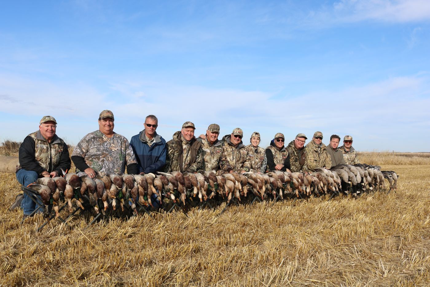 Wide group photo with a long line of Saskatchewan waterfowl bag