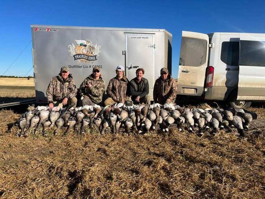 Saskatchewan Canada goose hunters with stubble-field harvest after a guided goose hunt